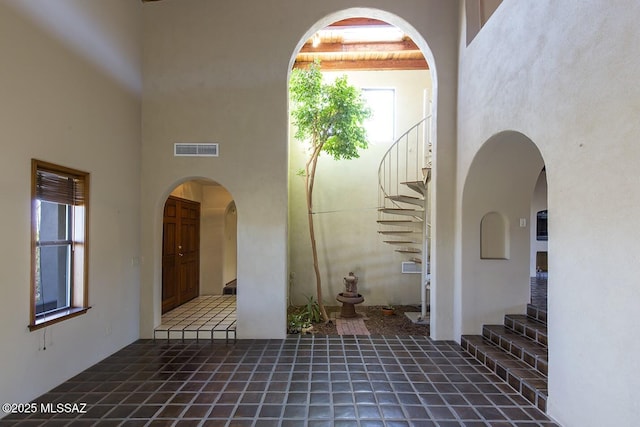 interior space with a high ceiling