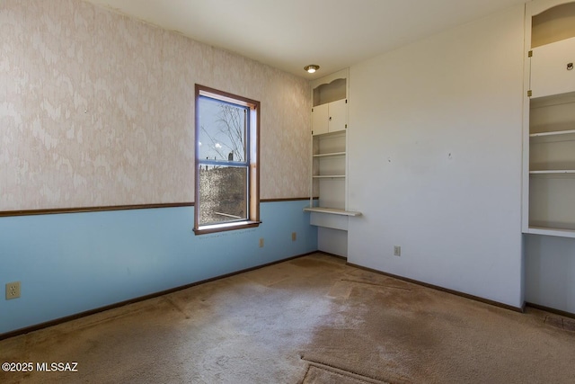 spare room featuring carpet flooring