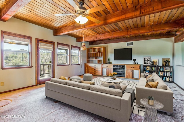 living room with beamed ceiling, wood ceiling, and light carpet