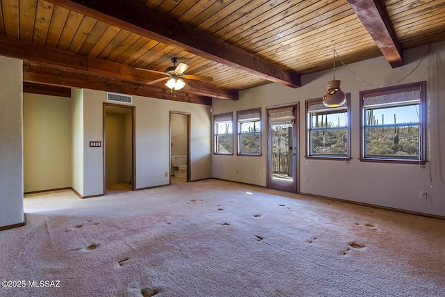 empty room with light carpet, beamed ceiling, wooden ceiling, and ceiling fan