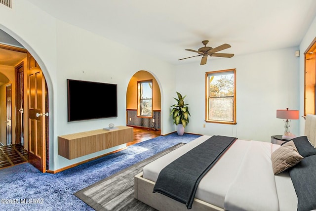 carpeted bedroom featuring ceiling fan