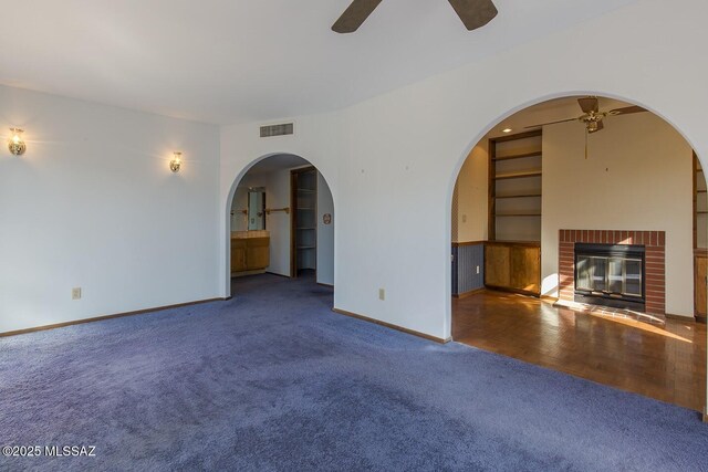 unfurnished bedroom featuring light colored carpet, access to outside, wooden ceiling, and beamed ceiling