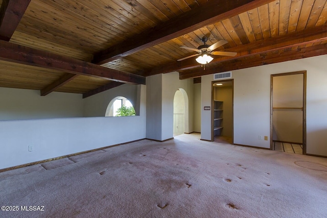 interior space with light carpet, ceiling fan, wooden ceiling, and beamed ceiling