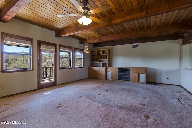 unfurnished living room featuring wood ceiling, beverage cooler, beam ceiling, and carpet