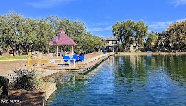 view of pool featuring a gazebo and a water view