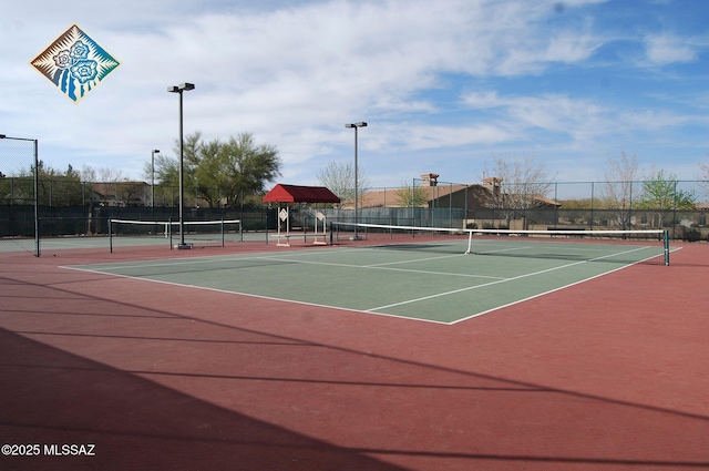 view of sport court featuring community basketball court and fence