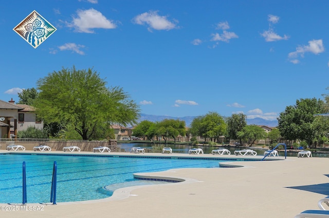 pool with fence, a patio area, and a mountain view