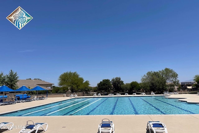 pool featuring a patio and fence