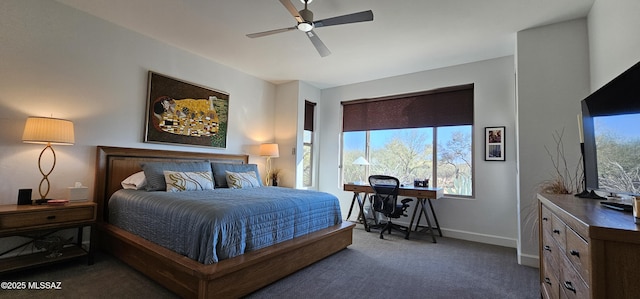 bedroom with ceiling fan and dark carpet