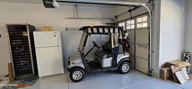 garage featuring a garage door opener and white fridge