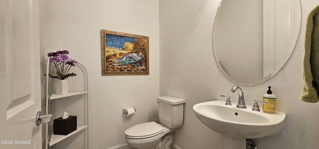 bathroom with sink and toilet