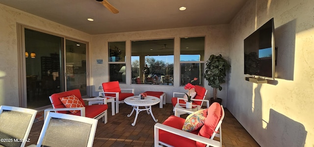 view of patio featuring ceiling fan