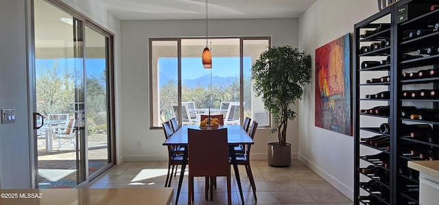 tiled dining space featuring a mountain view