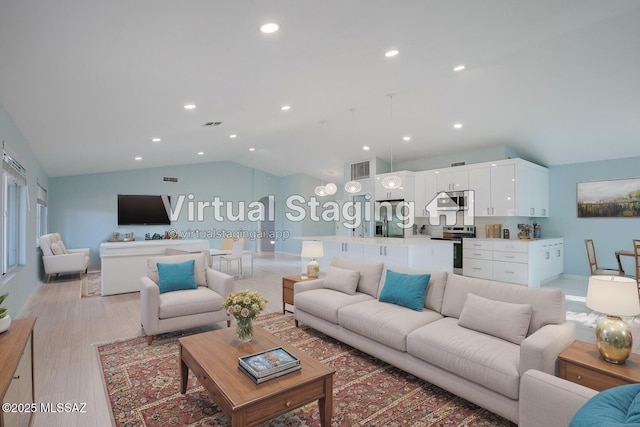 living area with lofted ceiling, light wood finished floors, visible vents, and recessed lighting