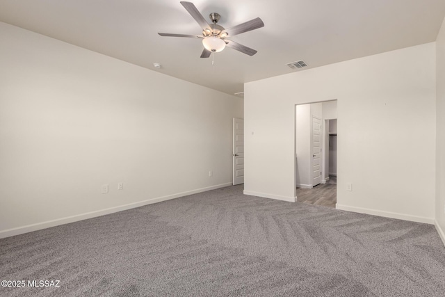 empty room with light colored carpet and ceiling fan