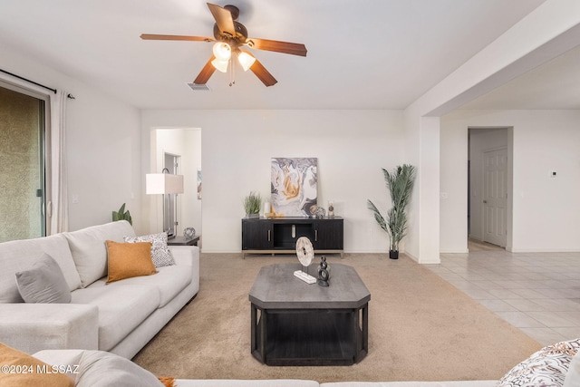 living room featuring tile patterned flooring and ceiling fan