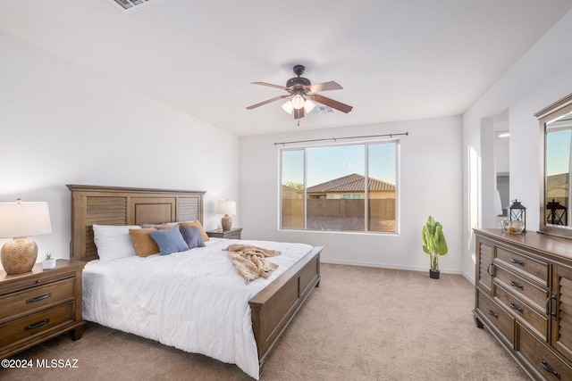 bedroom featuring ceiling fan and light carpet