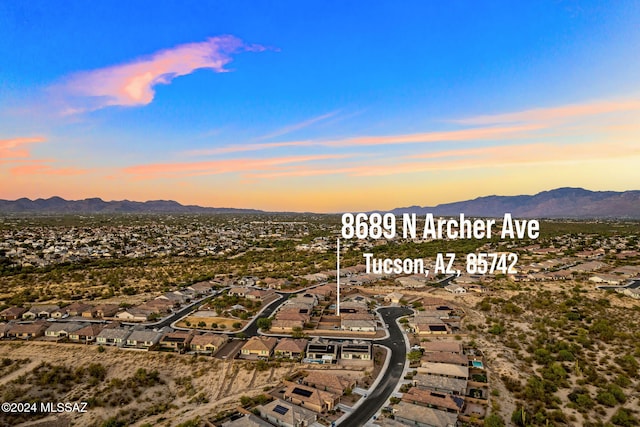 aerial view at dusk with a mountain view