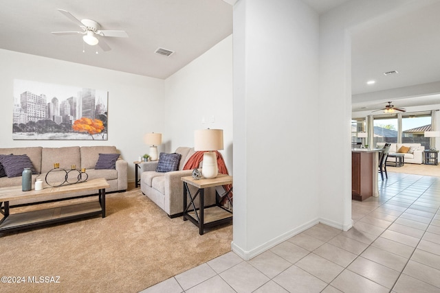 living room featuring light tile patterned flooring and ceiling fan