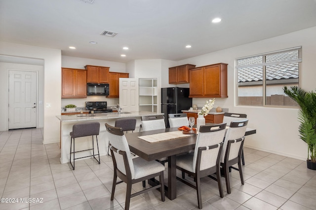 tiled dining area with sink