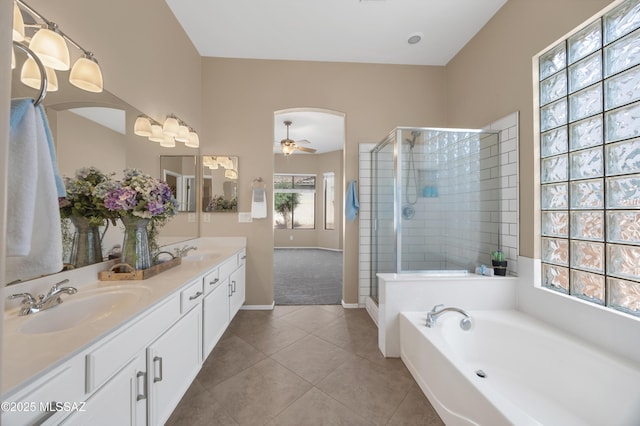 bathroom featuring tile patterned flooring, vanity, separate shower and tub, and ceiling fan