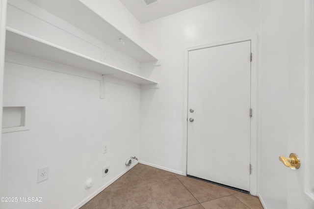 washroom featuring electric dryer hookup, washer hookup, hookup for a gas dryer, and light tile patterned flooring