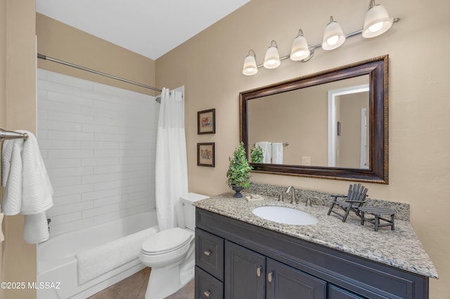 full bathroom featuring shower / bathtub combination with curtain, vanity, tile patterned flooring, and toilet