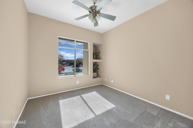 spare room with carpet flooring and ceiling fan