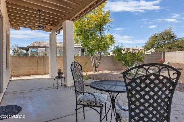 view of patio featuring ceiling fan