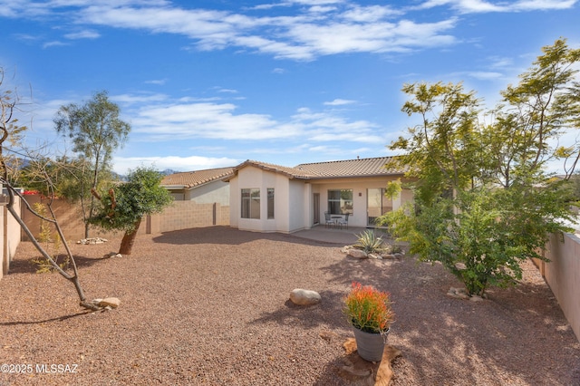 back of property with a patio area