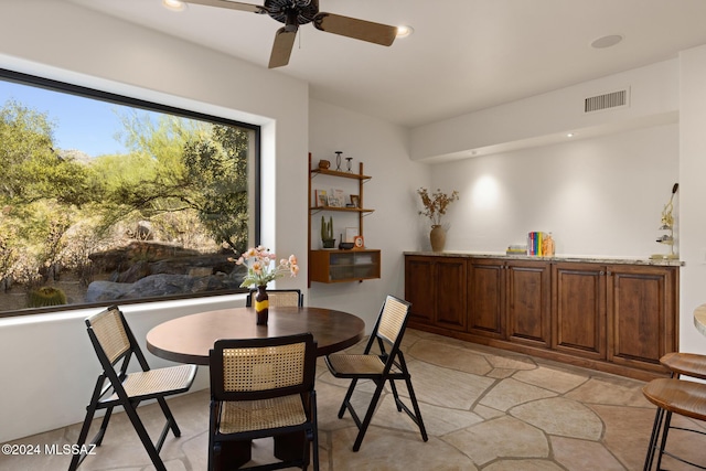 dining room with ceiling fan