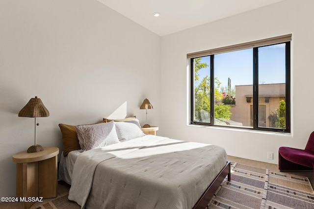 bedroom featuring multiple windows