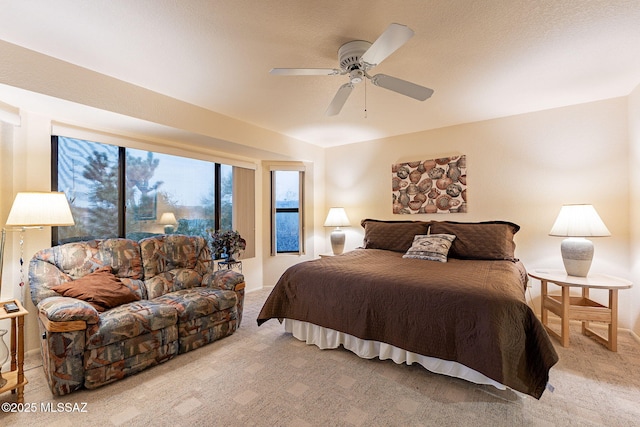 bedroom featuring ceiling fan and light colored carpet