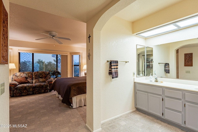 bathroom featuring vanity and ceiling fan