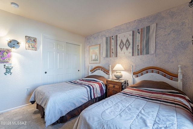 carpeted bedroom with a closet