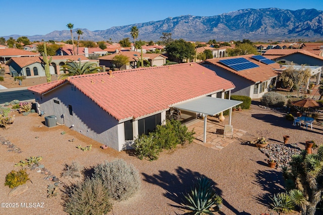 birds eye view of property with a mountain view