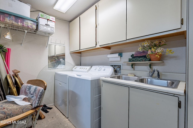 laundry area with cabinets, sink, and independent washer and dryer