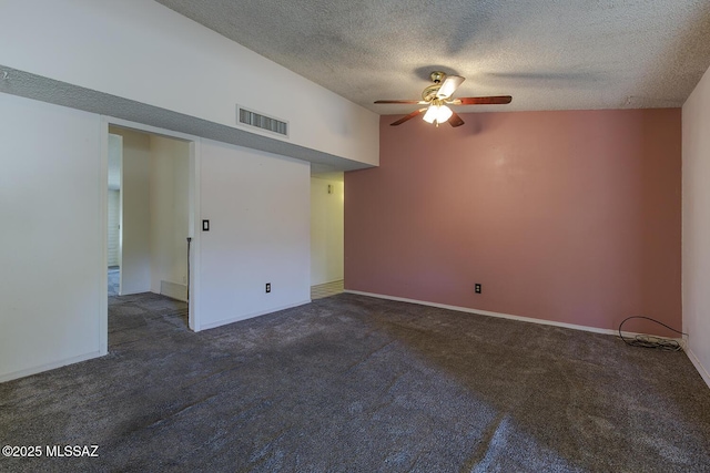 empty room with ceiling fan, high vaulted ceiling, a textured ceiling, and dark carpet