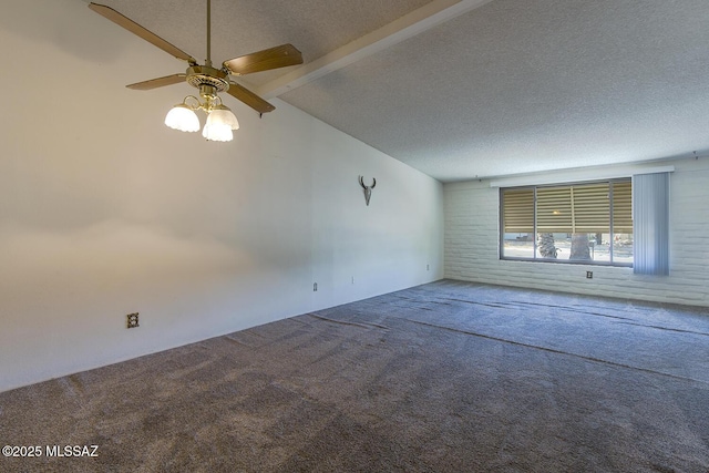 carpeted spare room featuring vaulted ceiling with beams, a textured ceiling, and ceiling fan