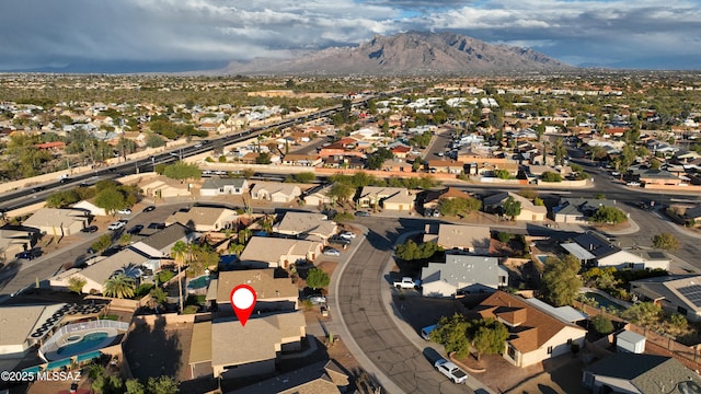 drone / aerial view featuring a residential view and a mountain view