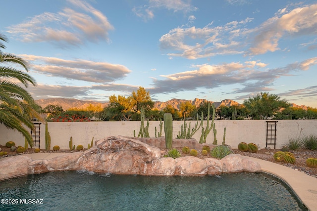 view of pool with a mountain view