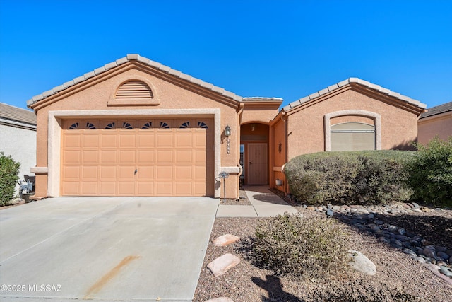 ranch-style home featuring a garage