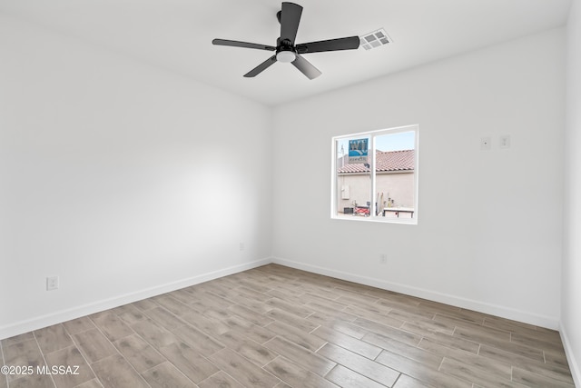 spare room with ceiling fan