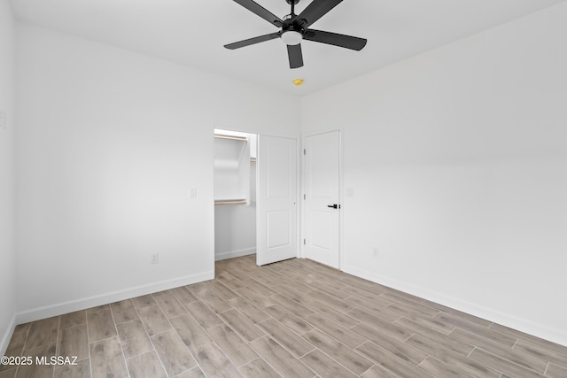 unfurnished bedroom with ceiling fan, light hardwood / wood-style floors, and a closet