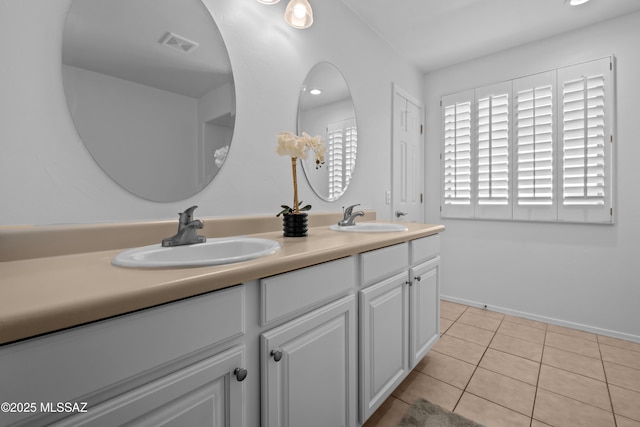 bathroom with tile patterned flooring and vanity