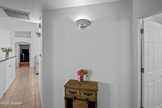 bathroom with walk in shower and tile patterned floors