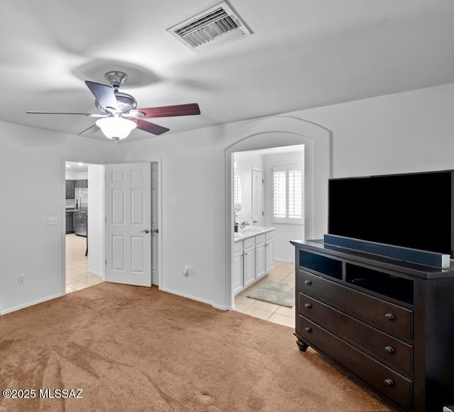 living room featuring light carpet and ceiling fan