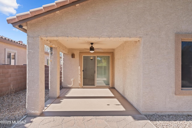 7715 E Fair Meadows Loop, Tucson, AZ 85756 - entrance to property featuring a ceiling fan, stucco siding, and a patio area