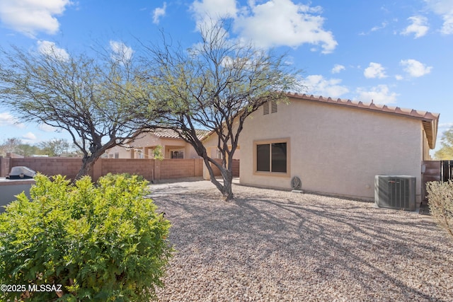 7715 E Fair Meadows Loop, Tucson, AZ 85756 - rear view of house with a fenced backyard, central air condition unit, stucco siding, and a tile roof