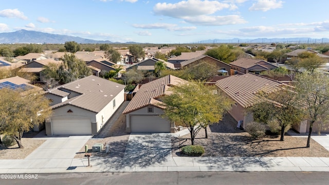 birds eye view of property with a mountain view